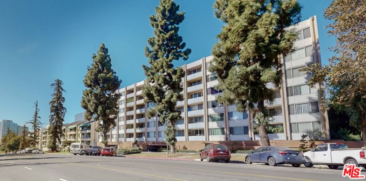 a city street lined with buildings and trees