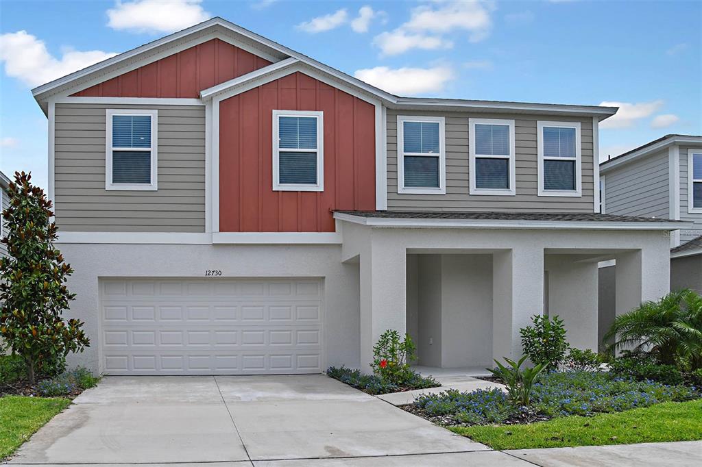 a front view of a house with a garage