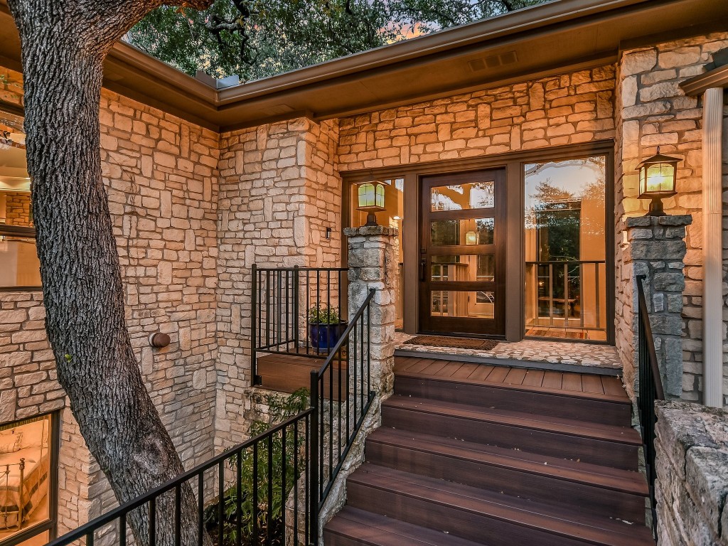 a view of a brick house with a large window