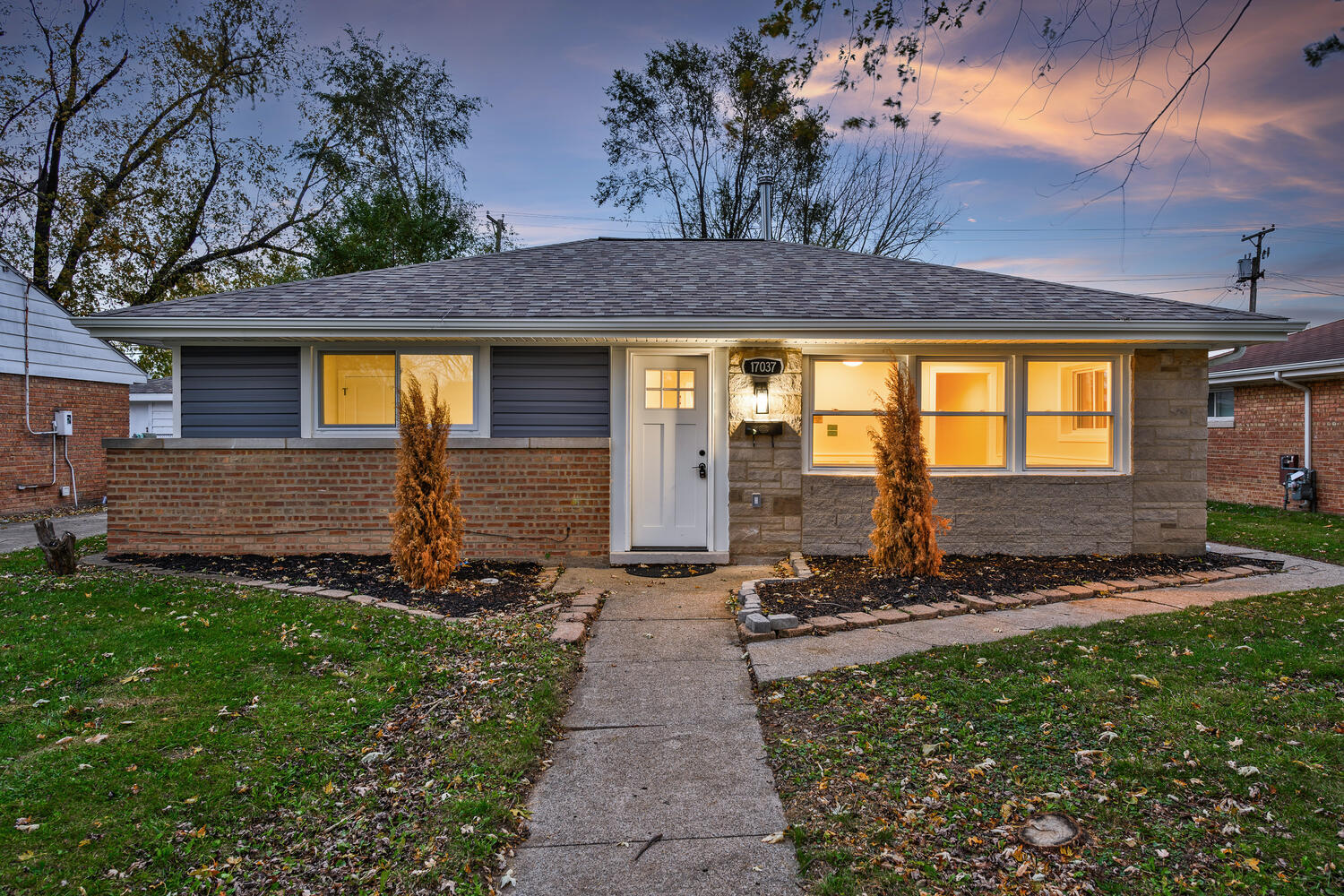 a front view of a house with a yard