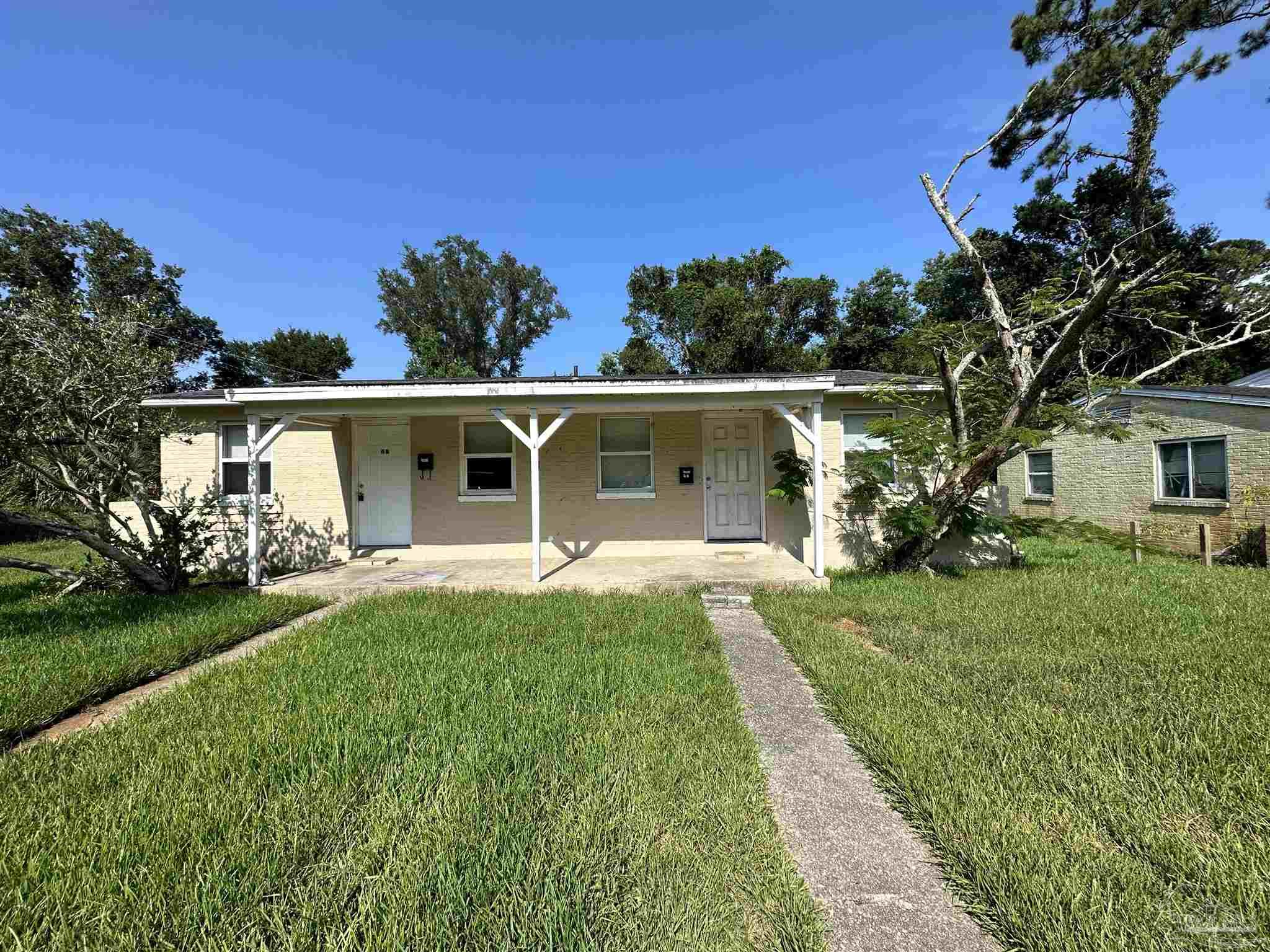 front view of a house with a yard