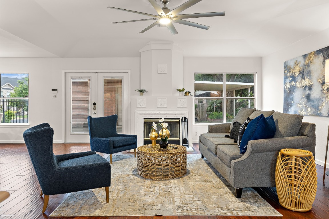 a living room with furniture and a fireplace