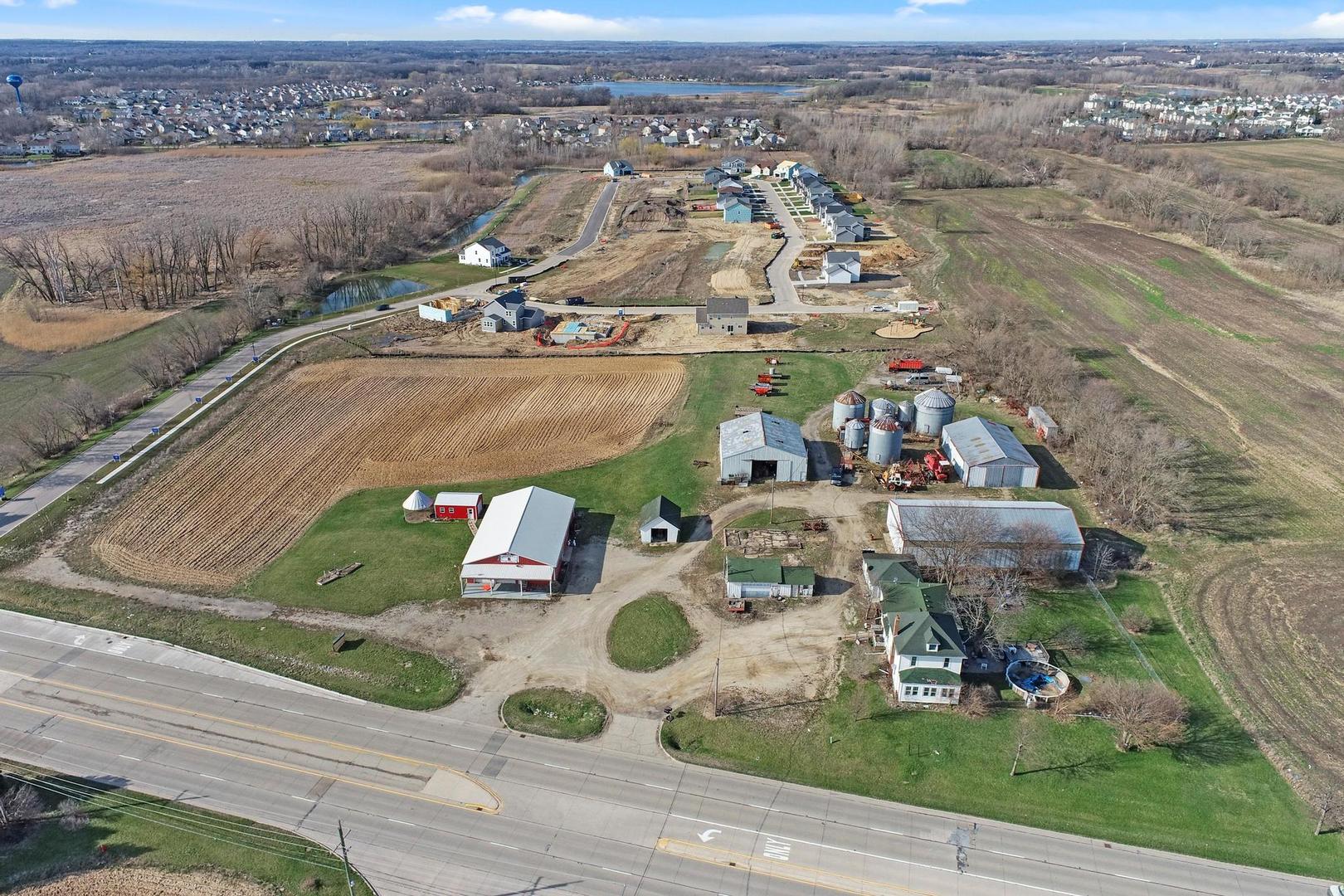 an aerial view of a house with garden space and street view