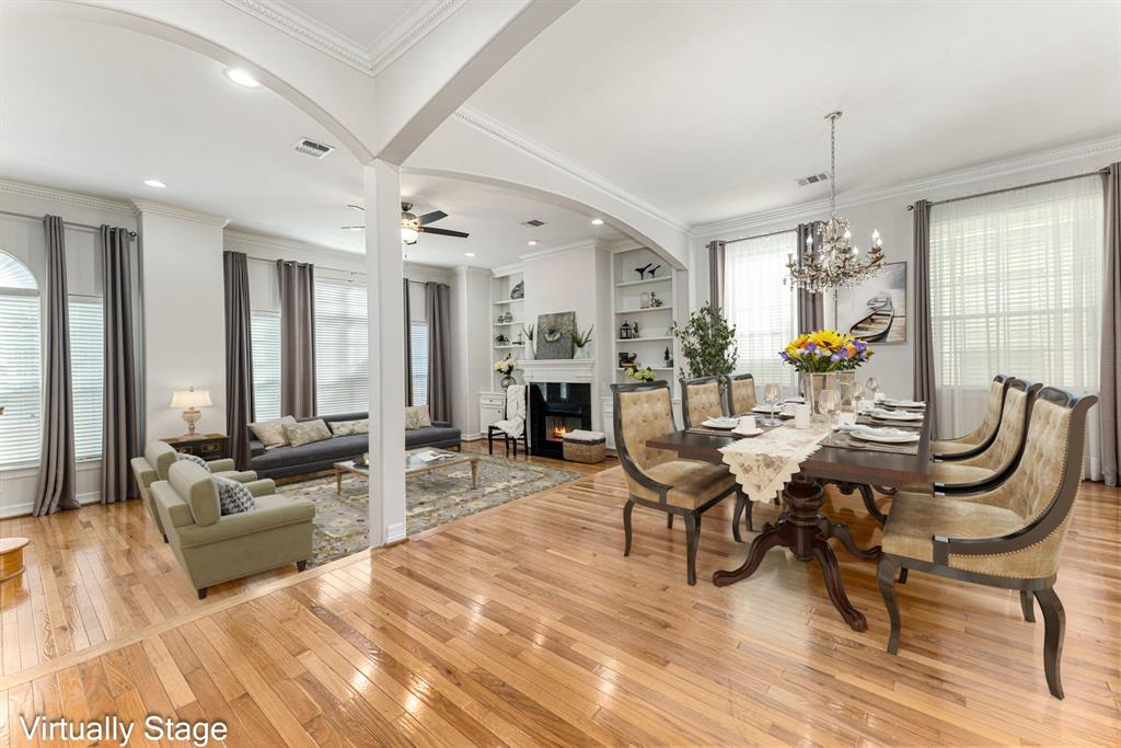 a living room with furniture or couch and a chandelier