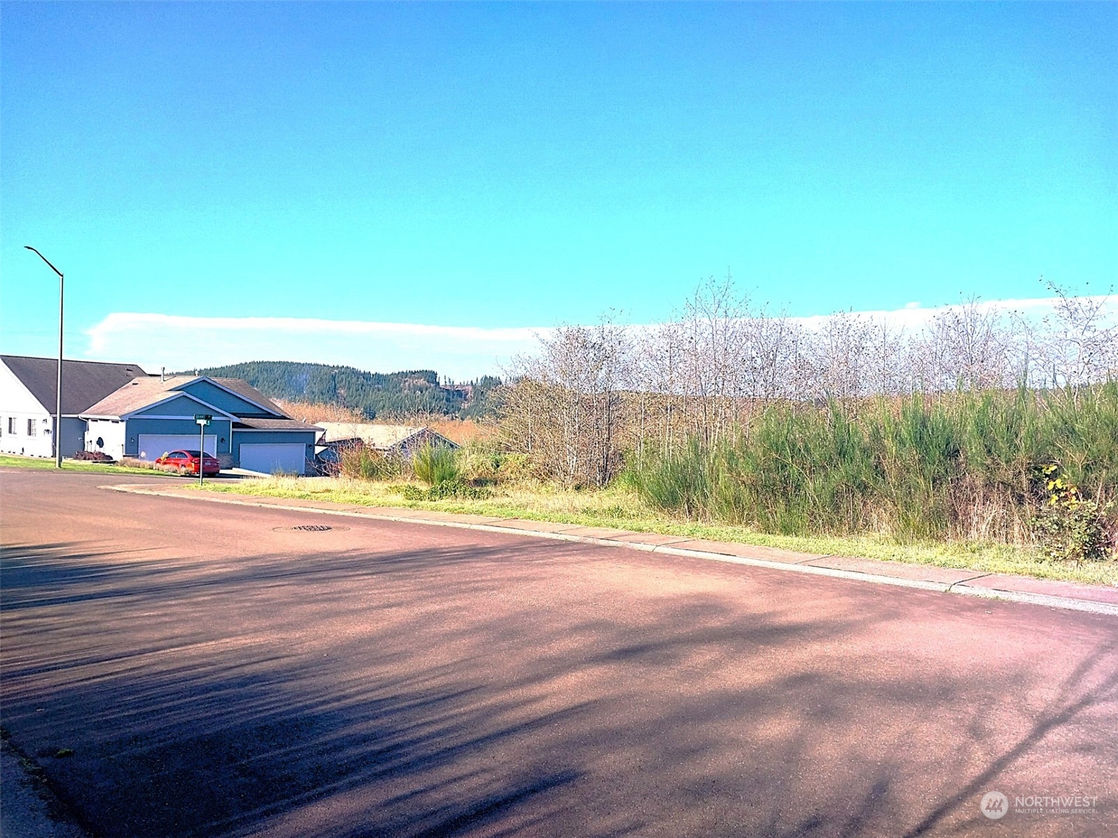 a view of a road with an ocean view