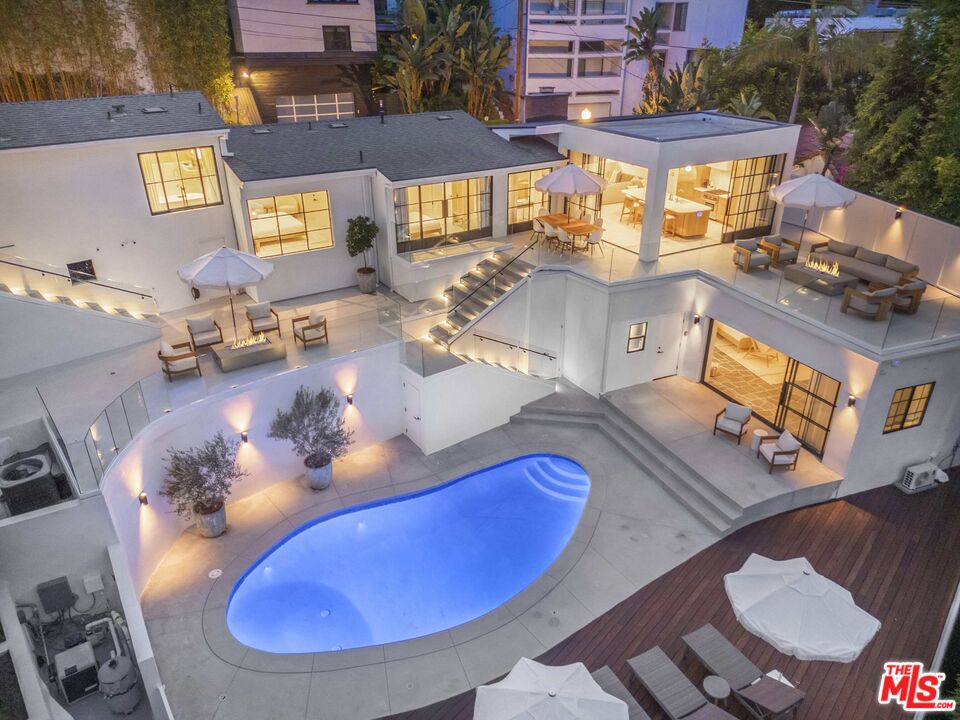 an aerial view of a house with swimming pool