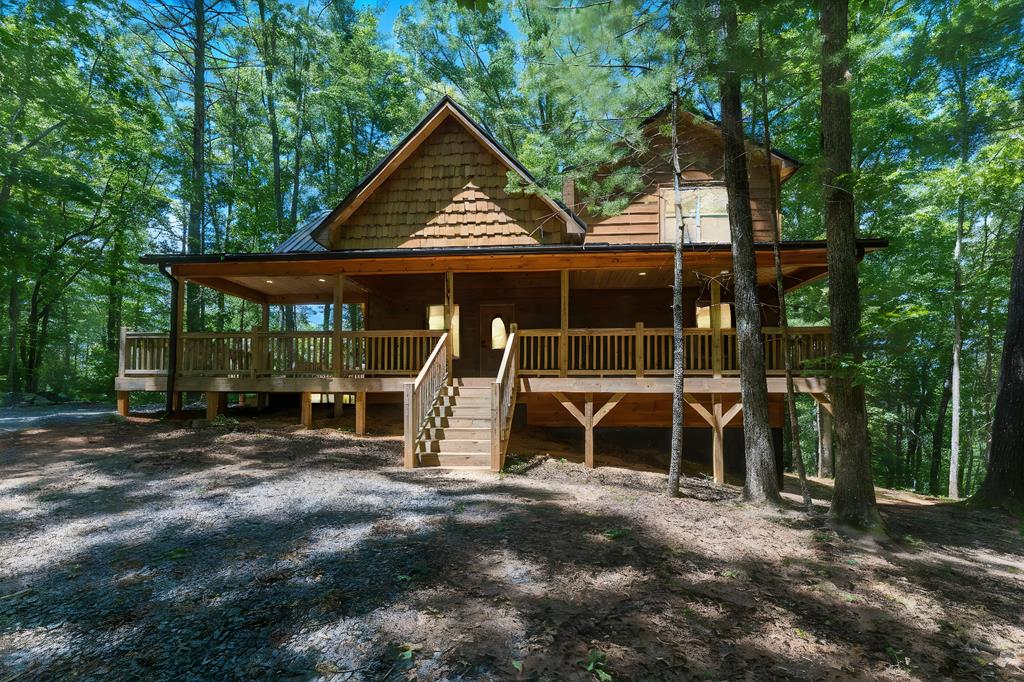 a view of a house with a yard and balcony