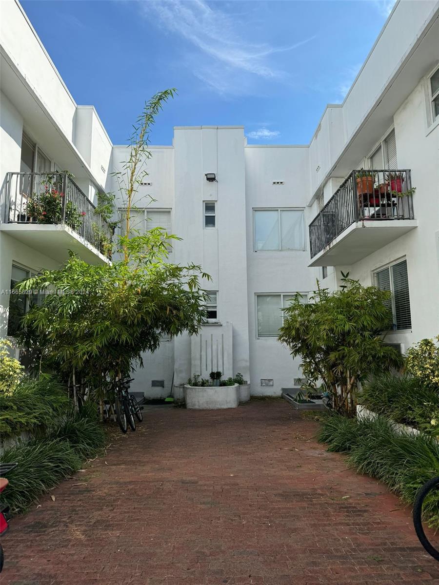 a view of a building with a street