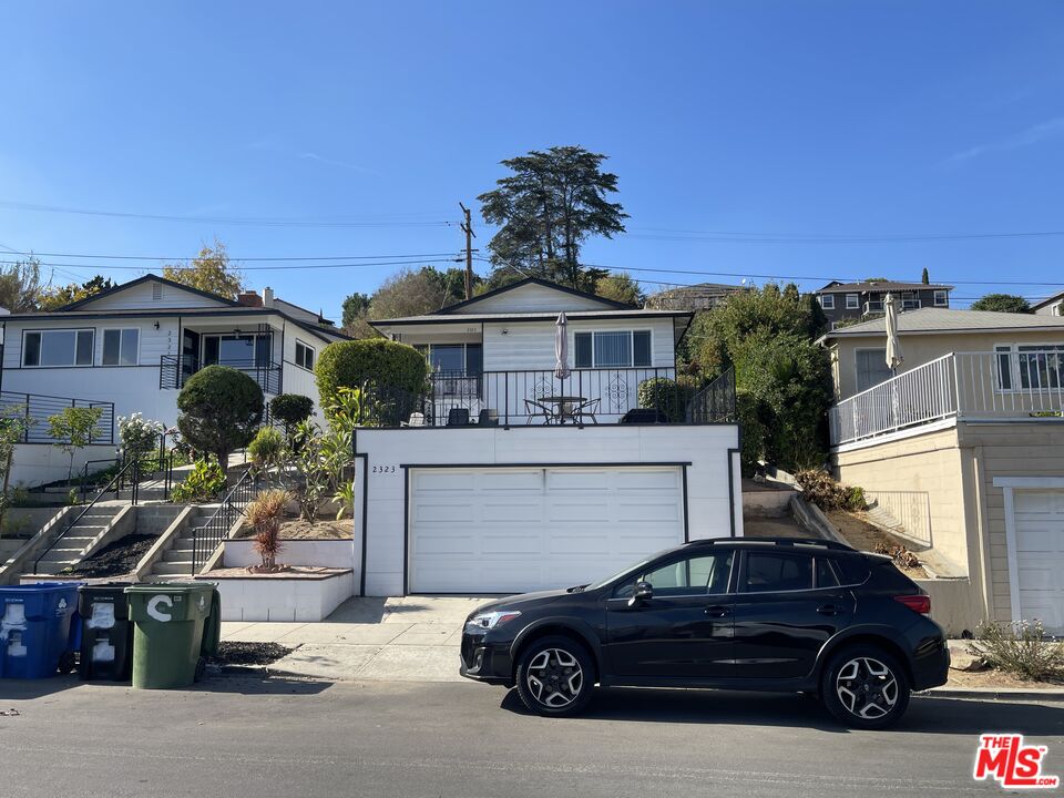 a car parked in front of a house