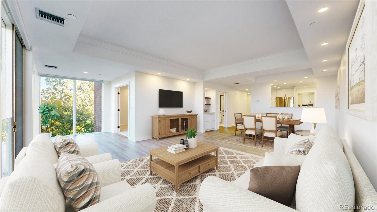 a living room with furniture fireplace and a large window