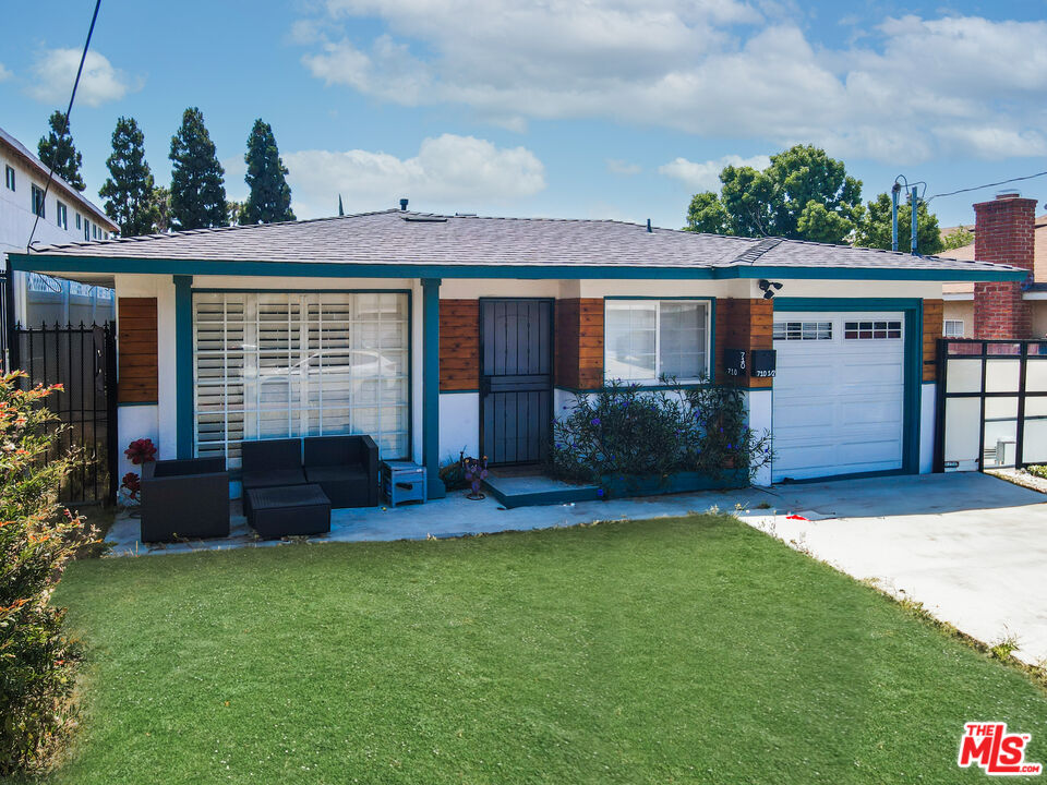 front view of a house with a yard