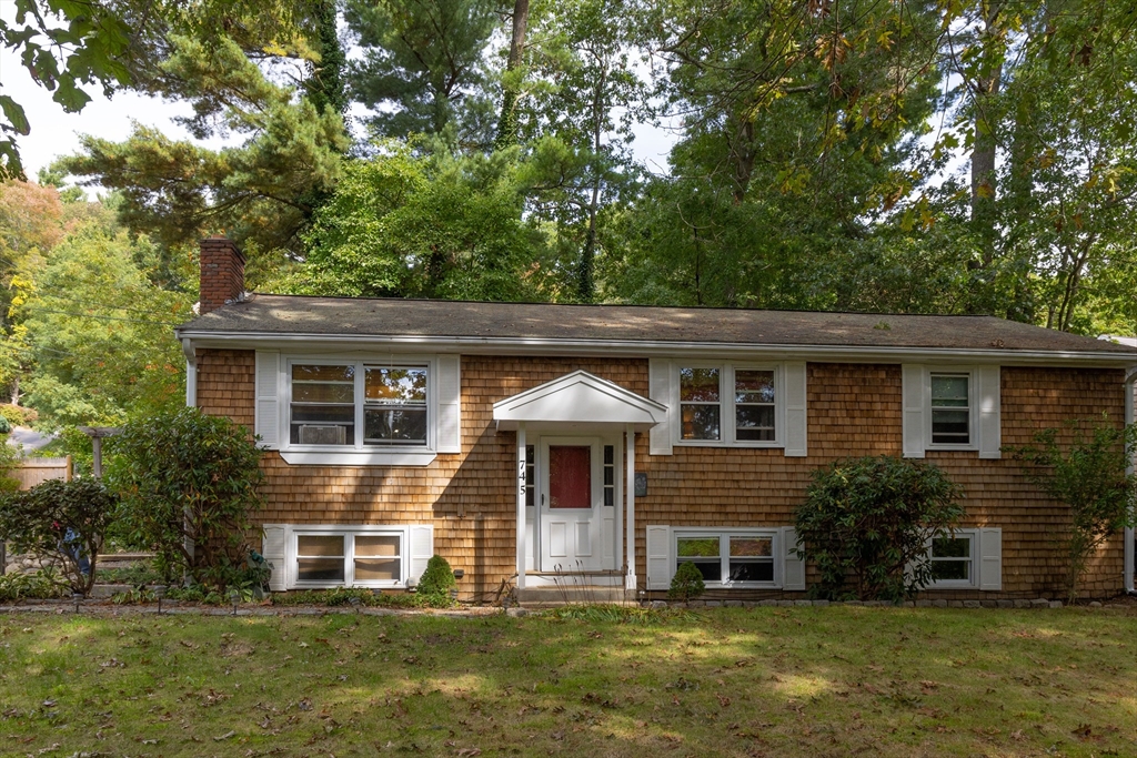 a front view of a house with a yard