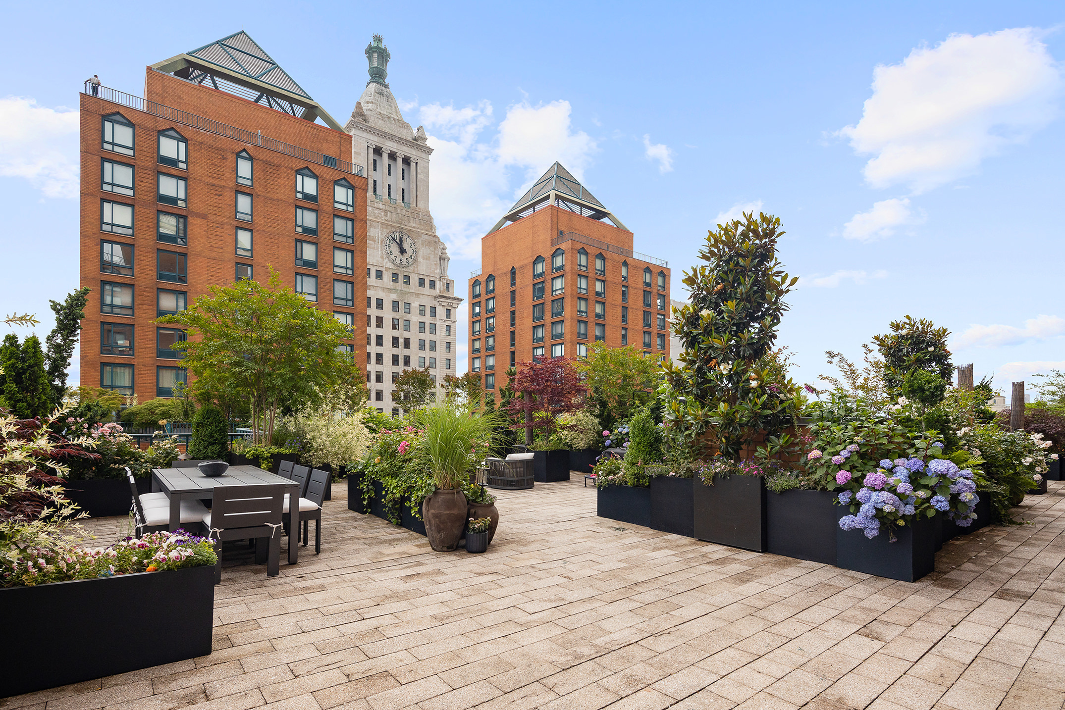 a view of a patio with couches and potted plants