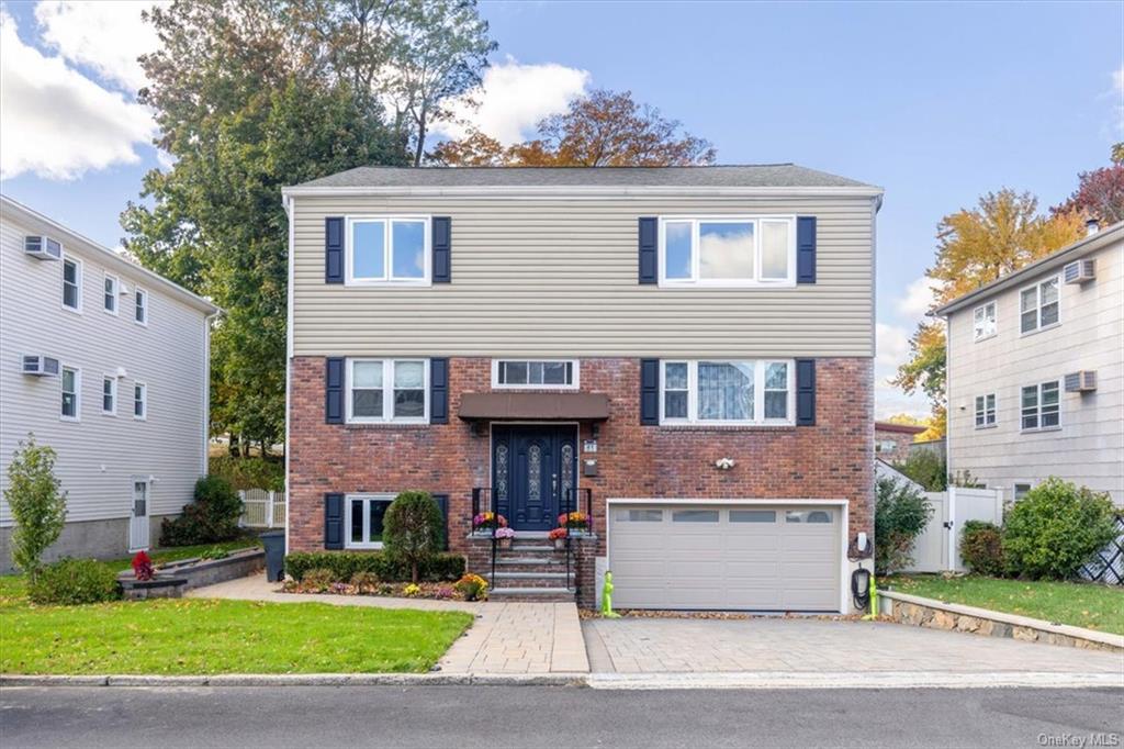 View of front of property with a garage