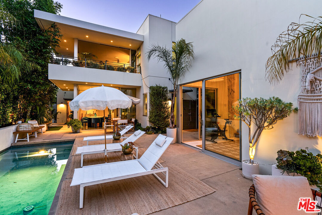 a view of a swimming pool with a patio