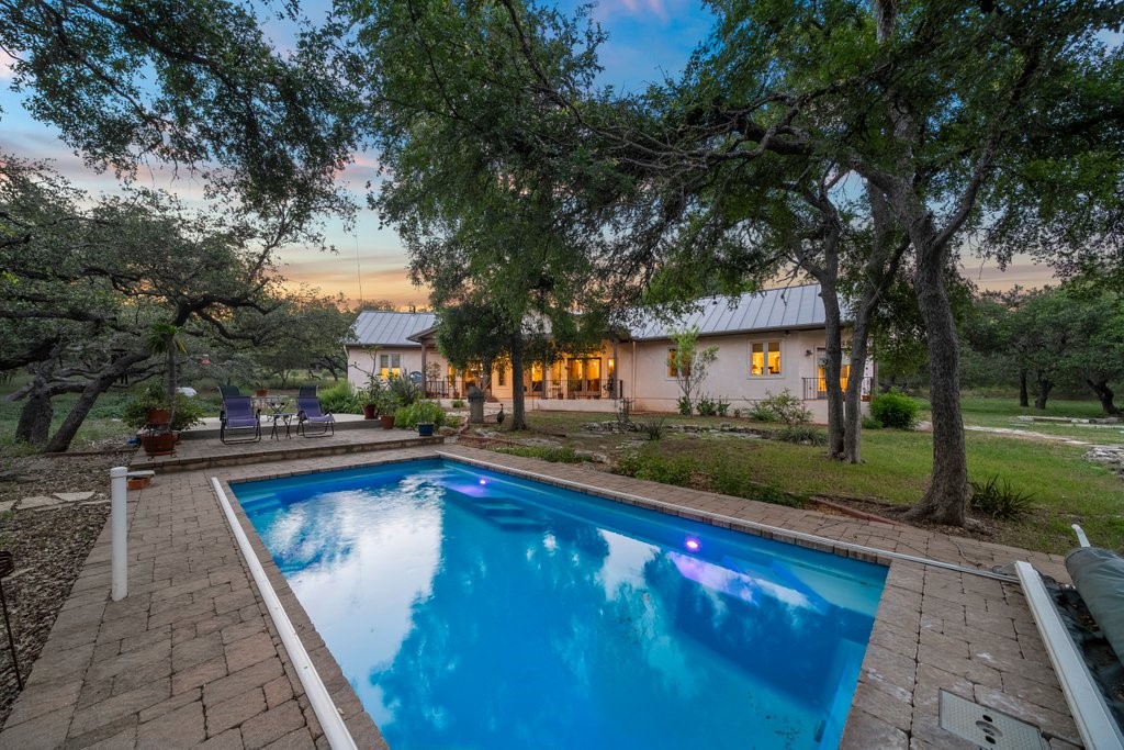 a view of swimming pool with lounge chair