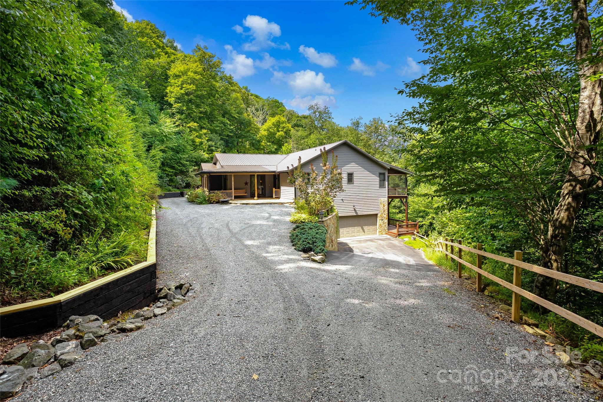 a view of a house with wooden fence