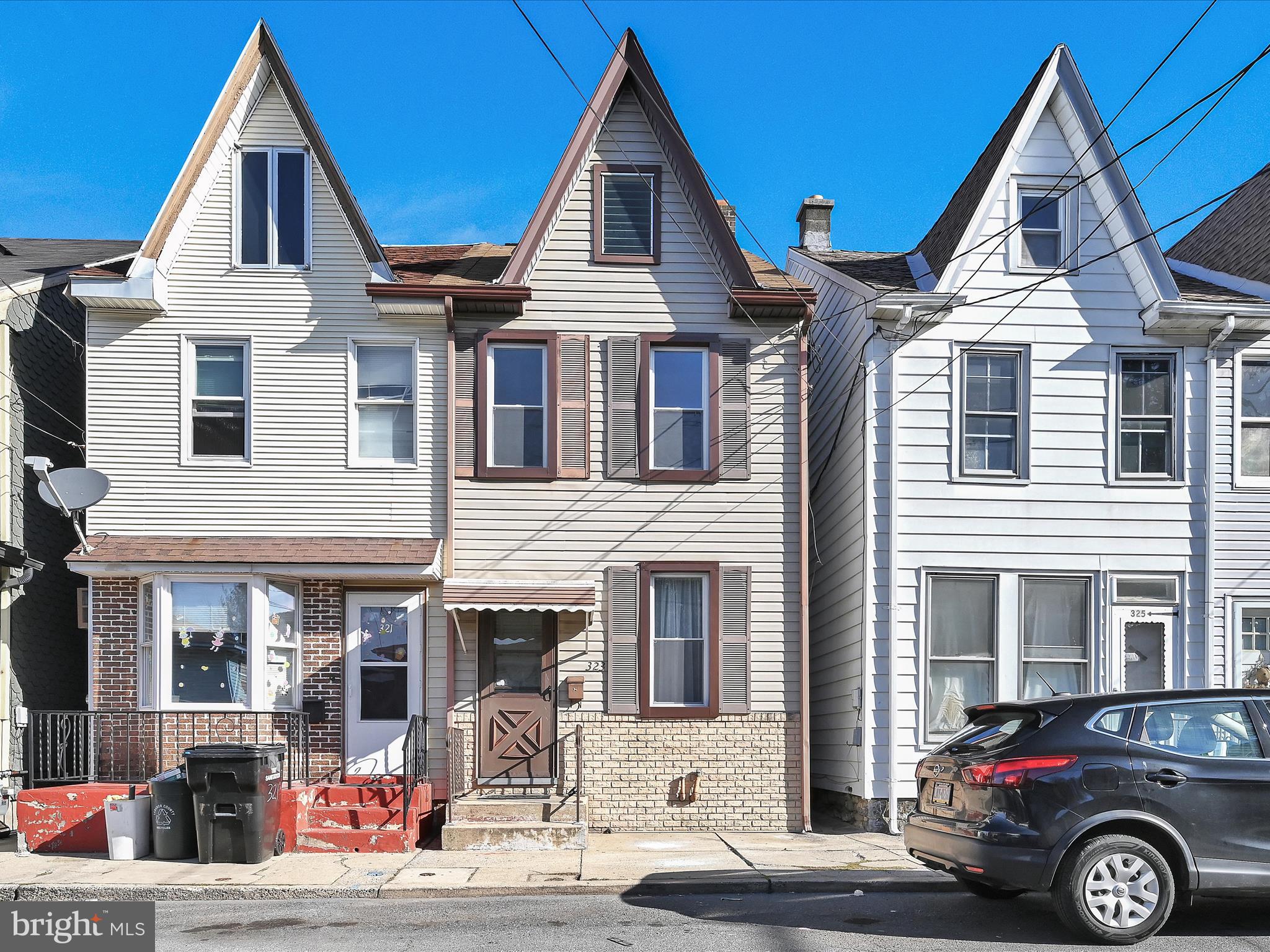 a front view of a house with parking