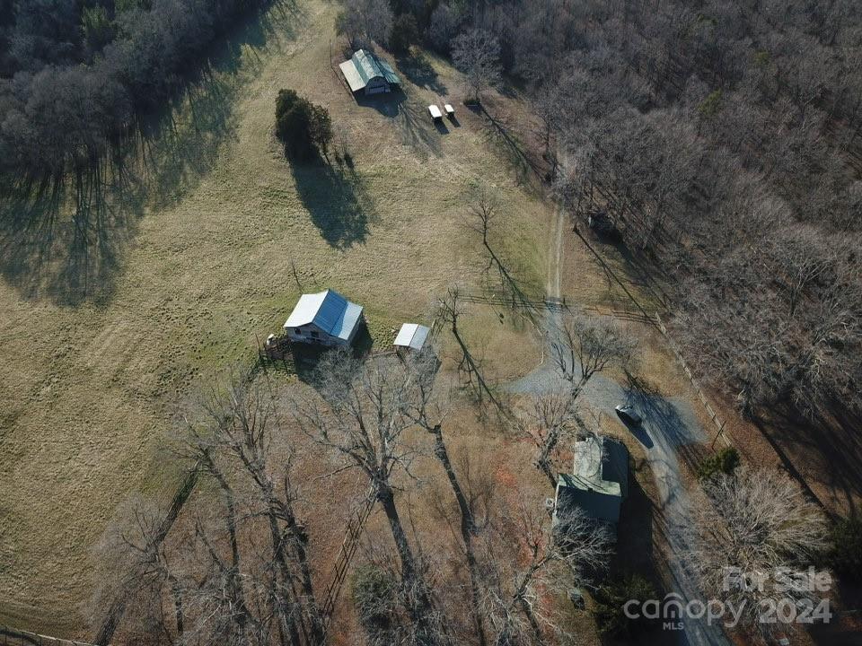 a aerial view of a house with a yard