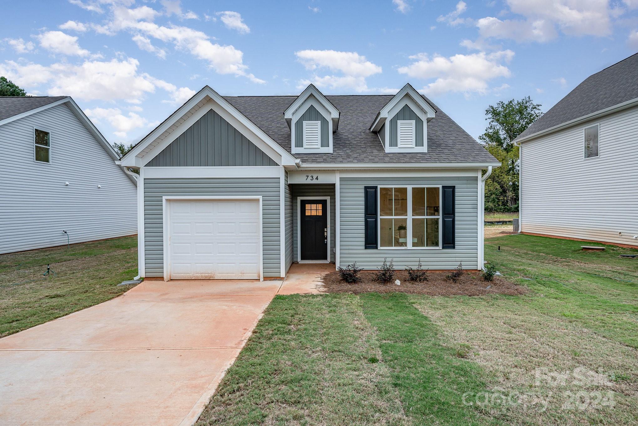 front view of a house with a yard