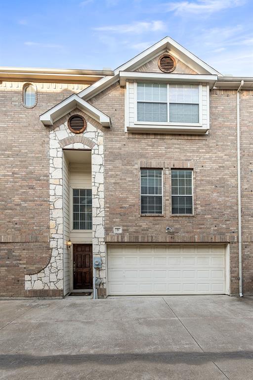 a front view of a house with garage