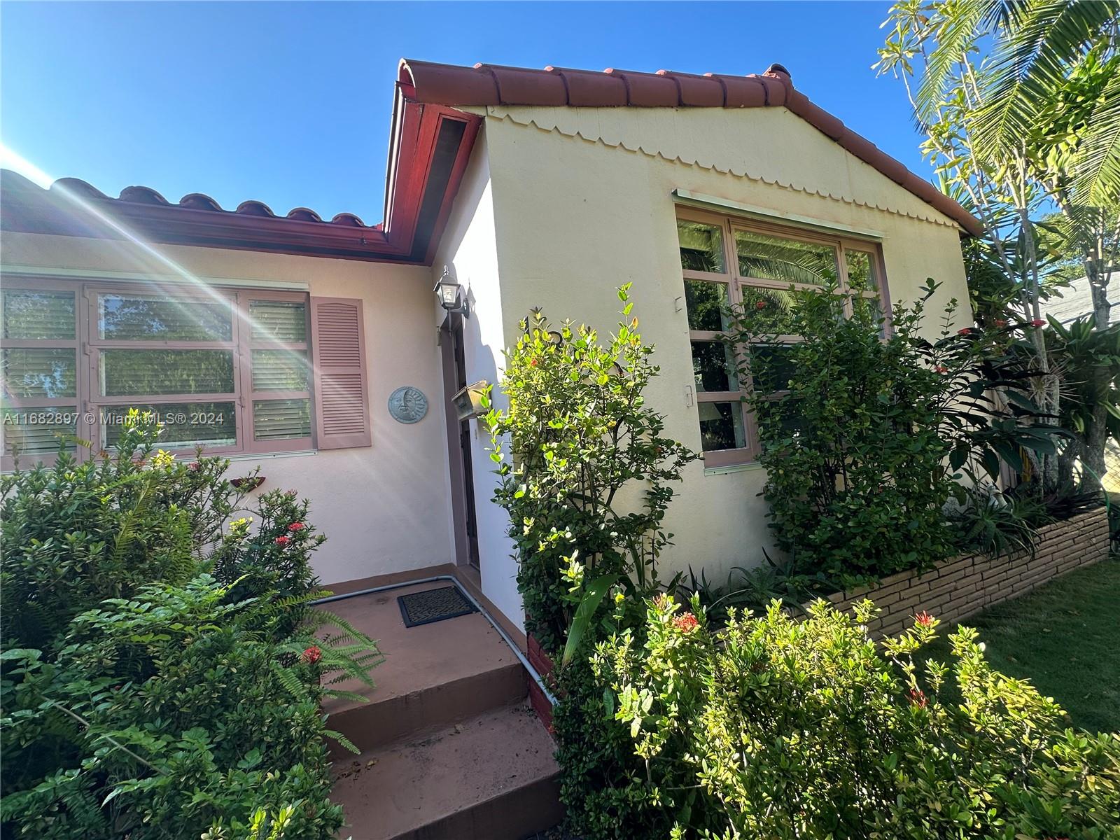 front view of a house with a yard