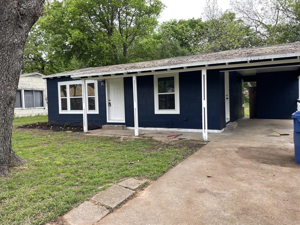 front view of a house with a yard