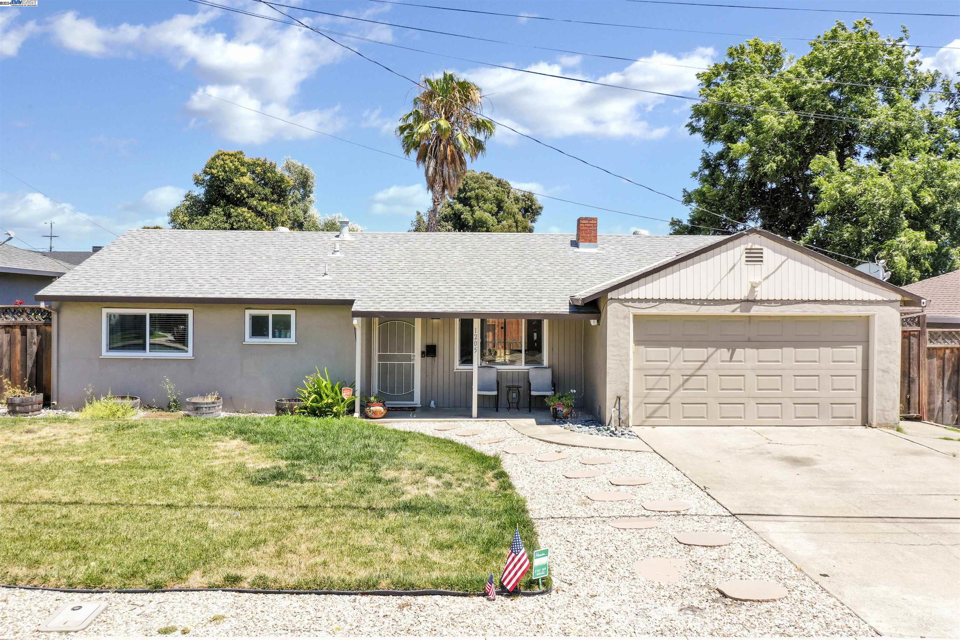 a front view of a house with garden