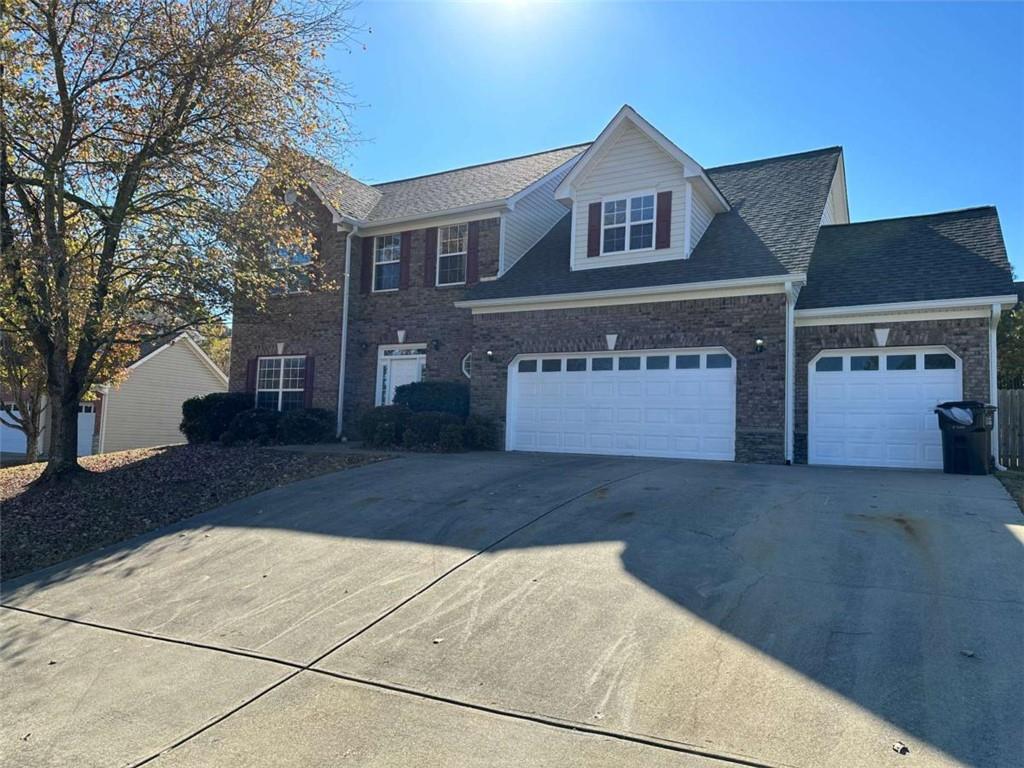 a front view of a house with yard