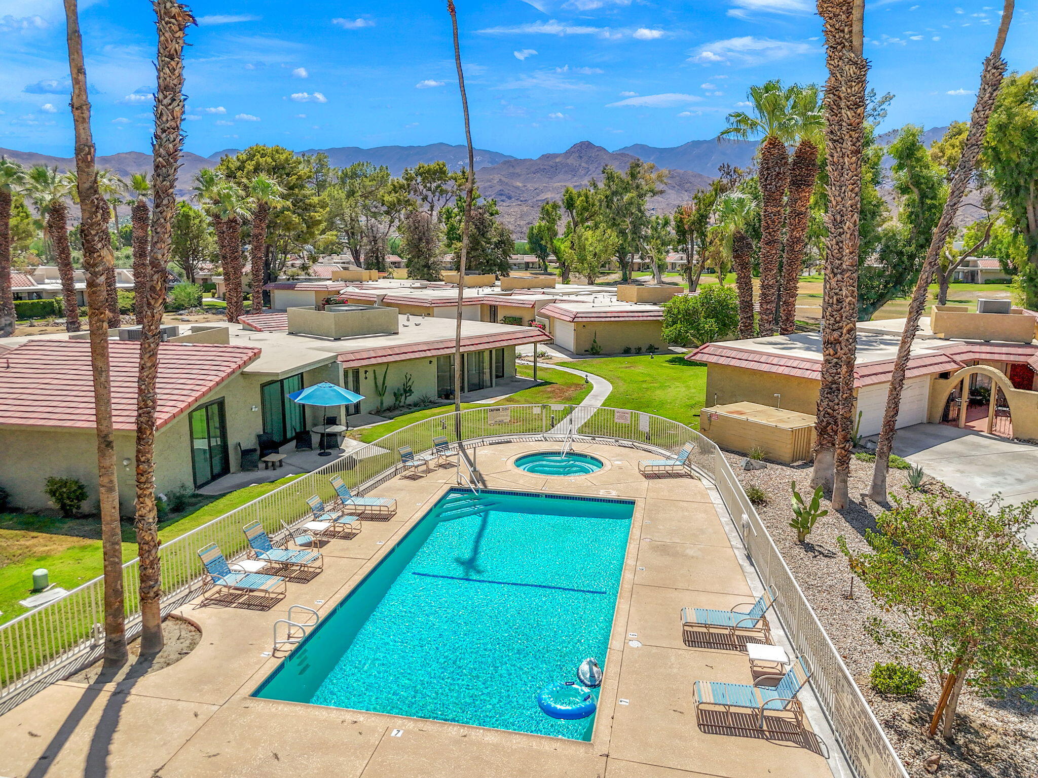 a view of a swimming pool with a patio