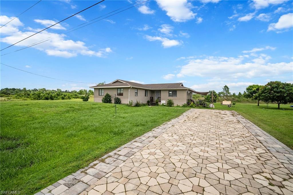 Ranch-style house with a front yard