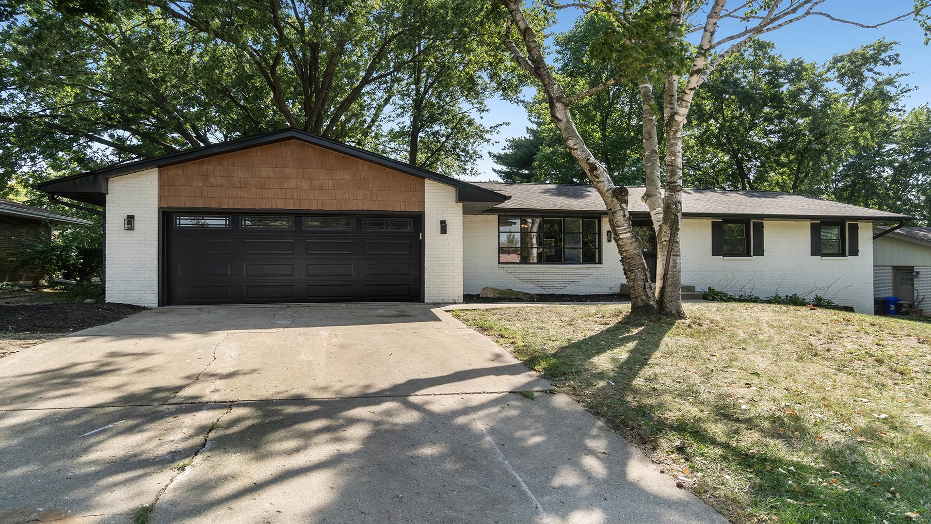 a house with trees in front of it