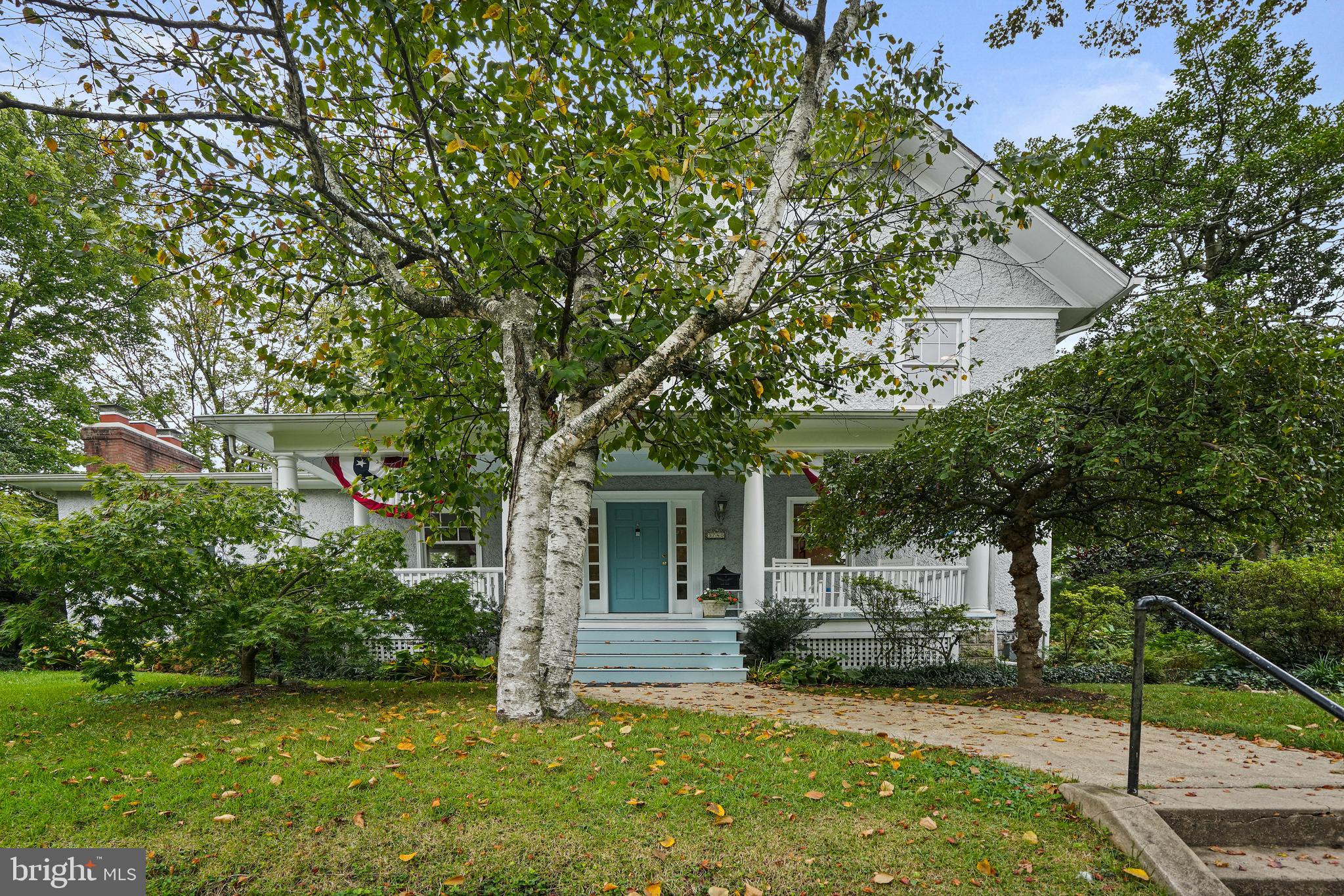 a view of a house with backyard porch and sitting area