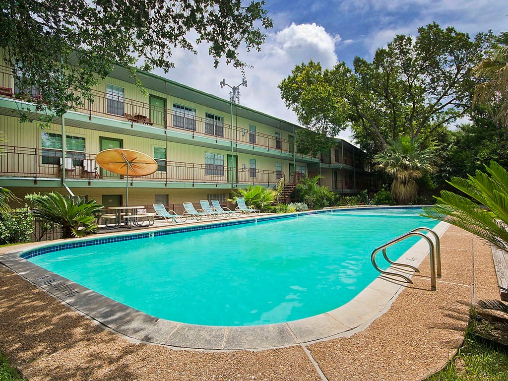 a view of a swimming pool with a garden