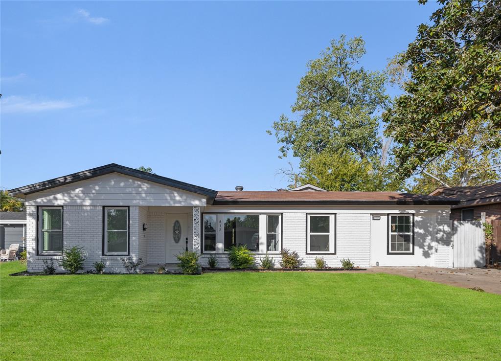 front view of a house with a garden