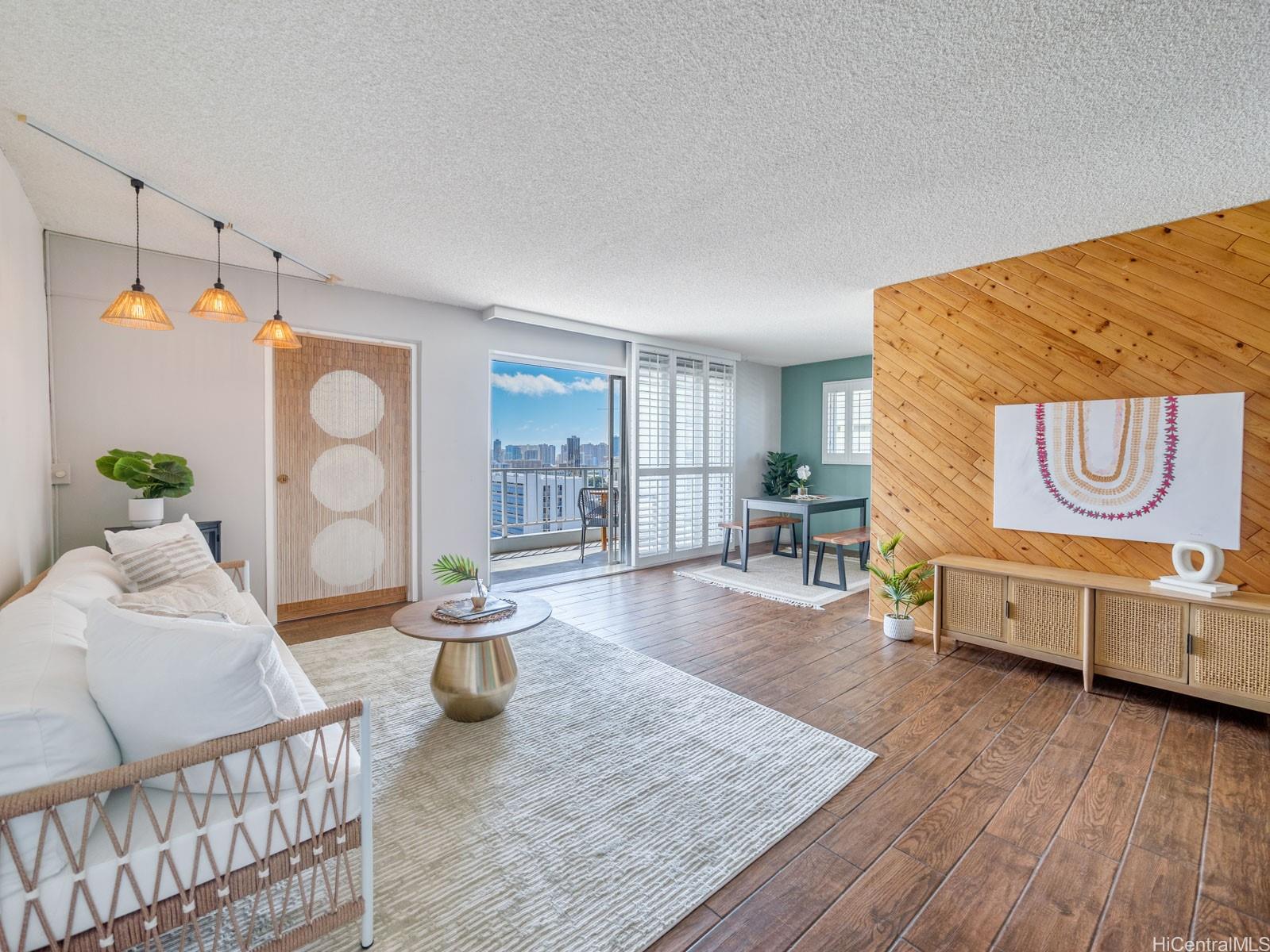 a living room with furniture and a wooden floor