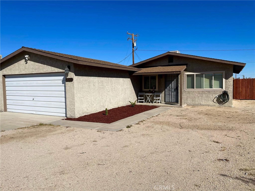 a view of a house with a yard and roof