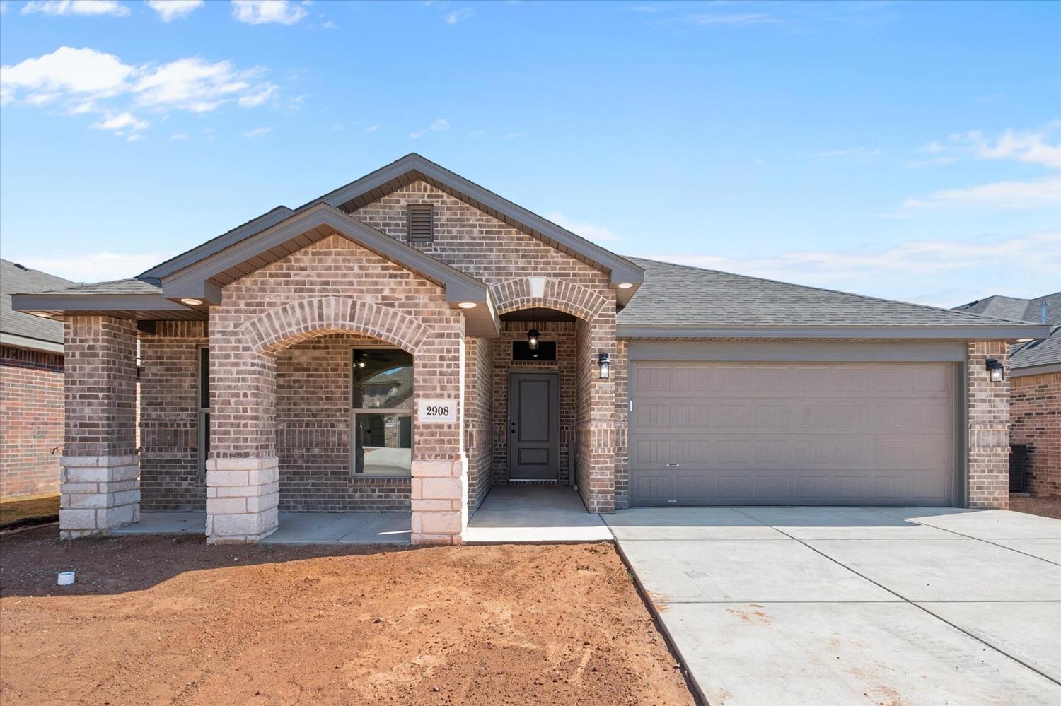 a front view of a house with a garage