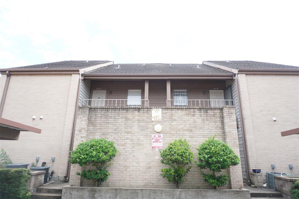 a front view of a house with garage