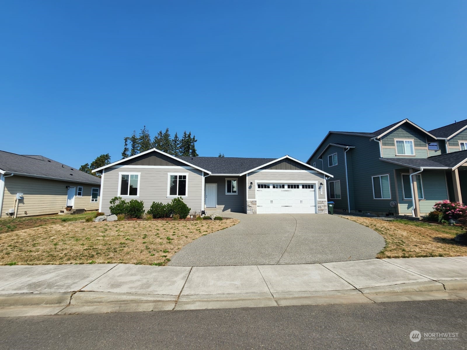 a front view of a house with a yard