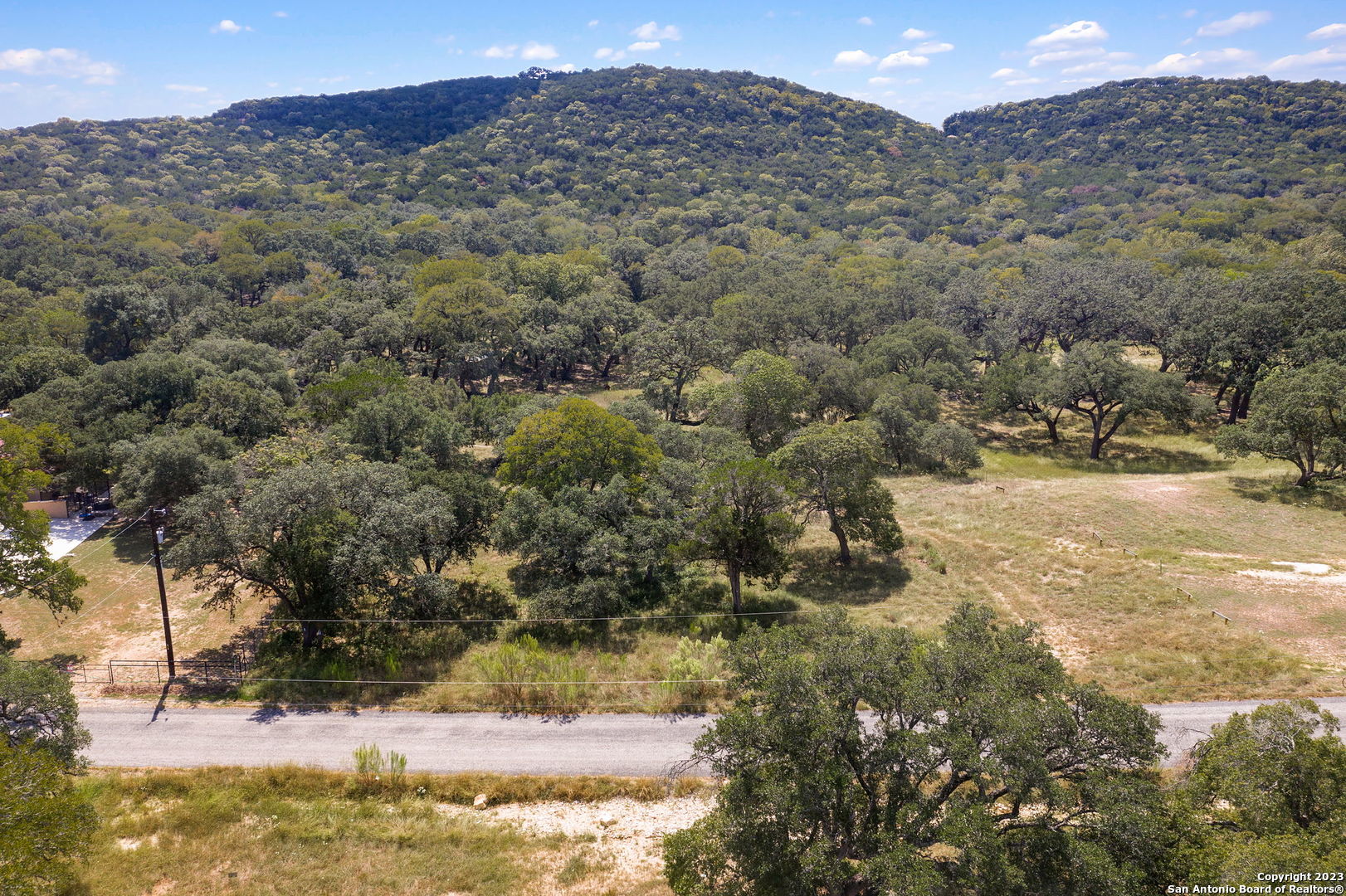 a view of a yard with a mountain