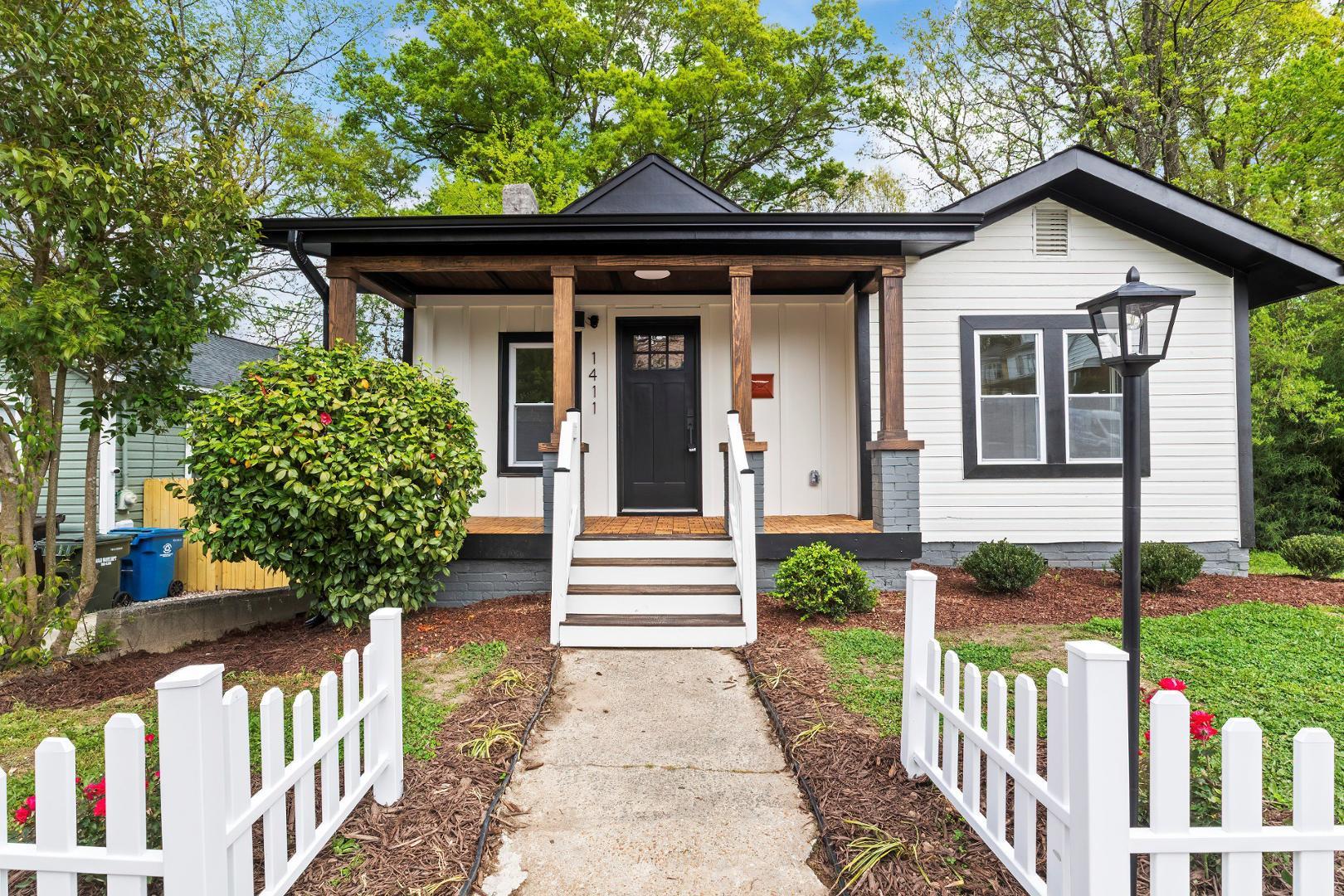 a front view of a house with garden