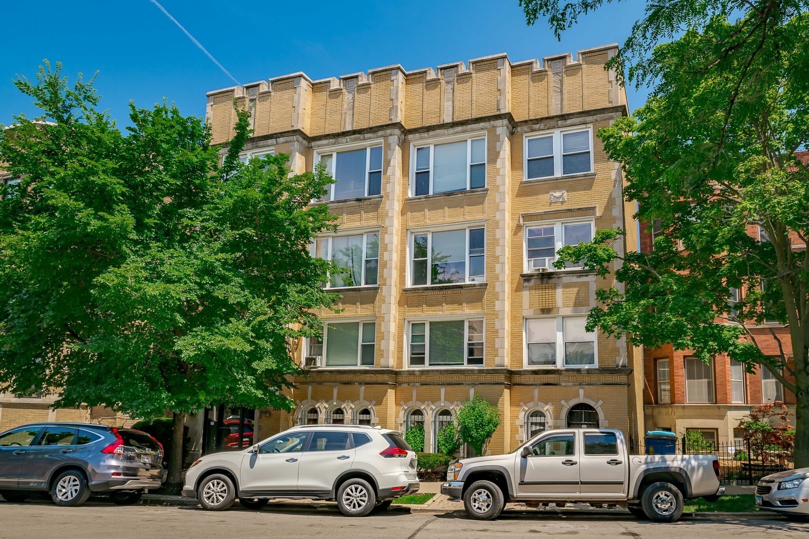 a view of a cars parked in front of a building