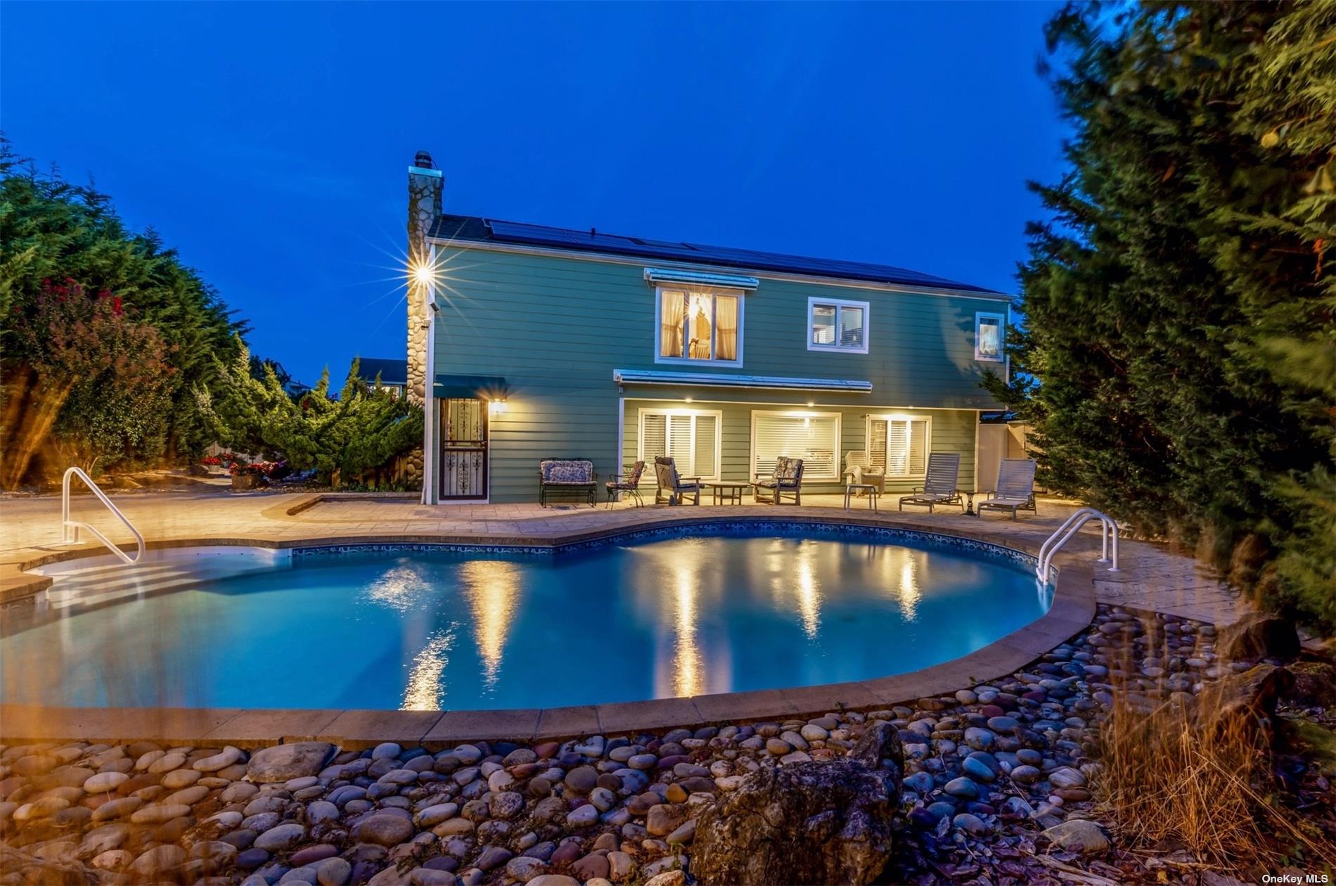 a view of a house with swimming pool