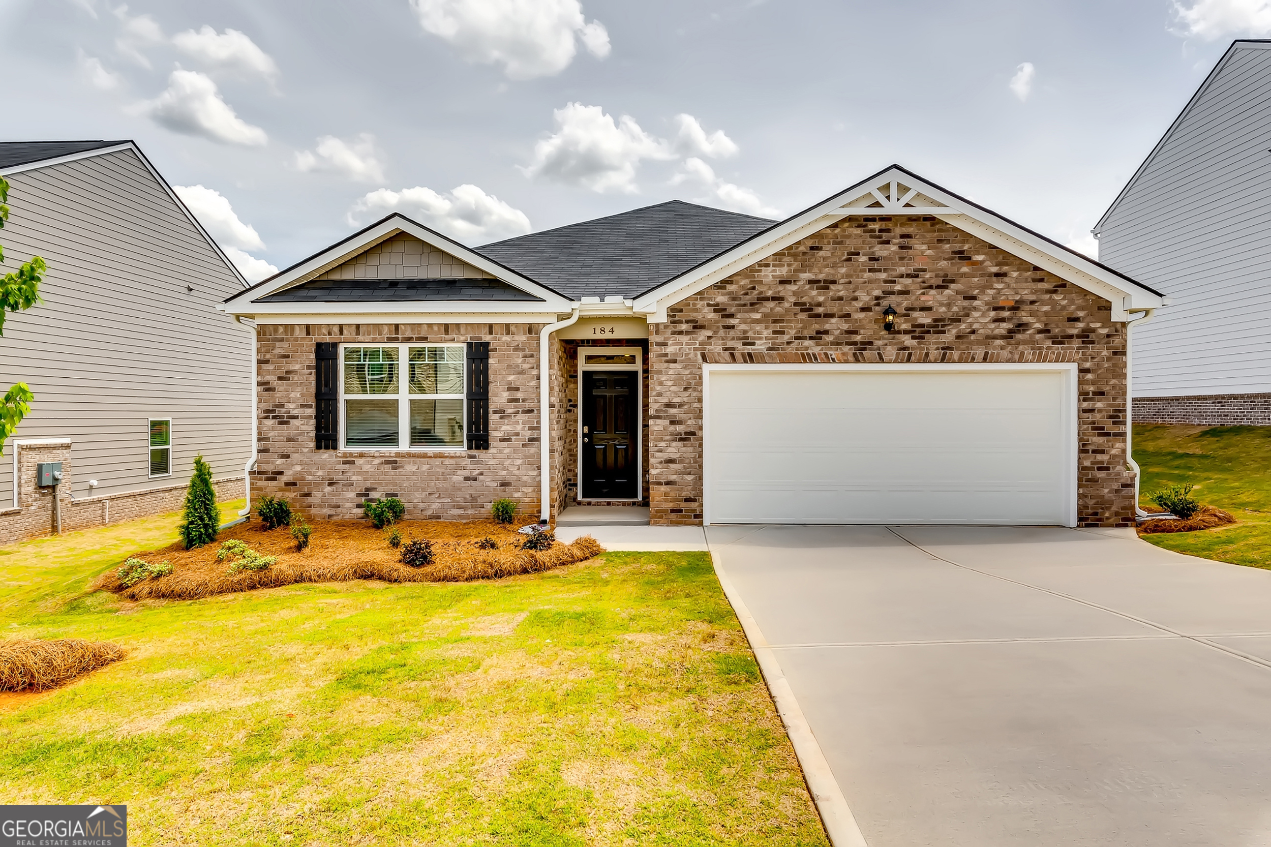 a front view of house with yard outdoor seating and barbeque oven