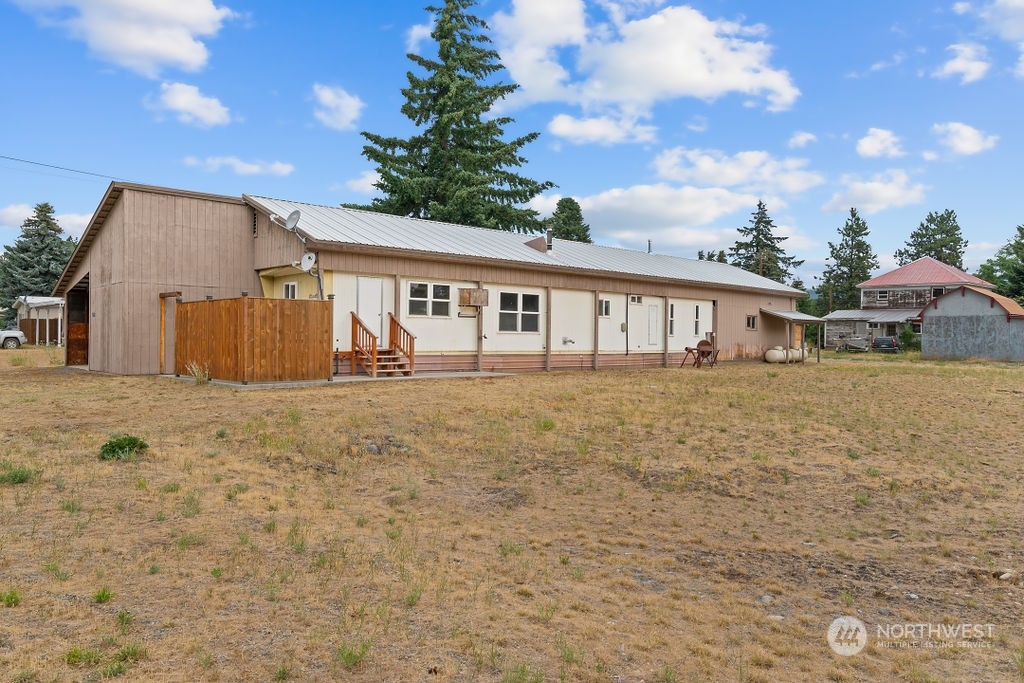 a view of a house with wooden fence