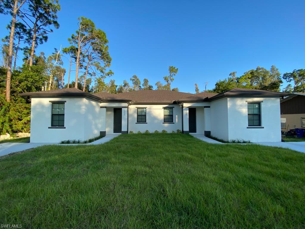 a view of a house with a backyard