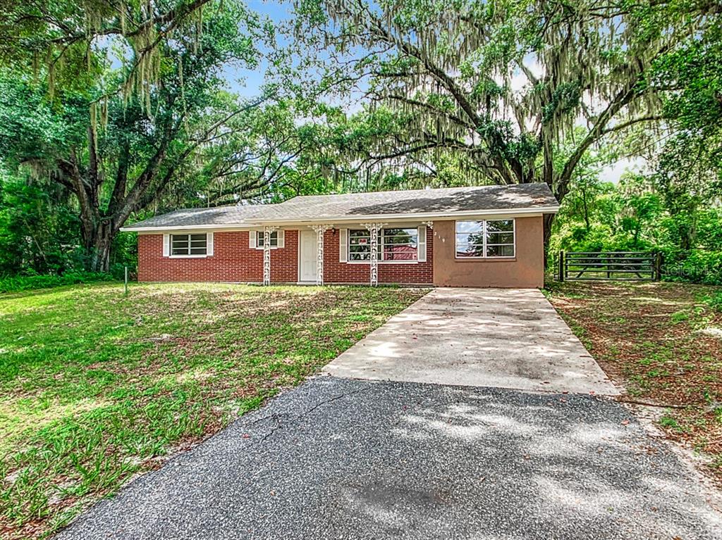 front view of a house next to a yard