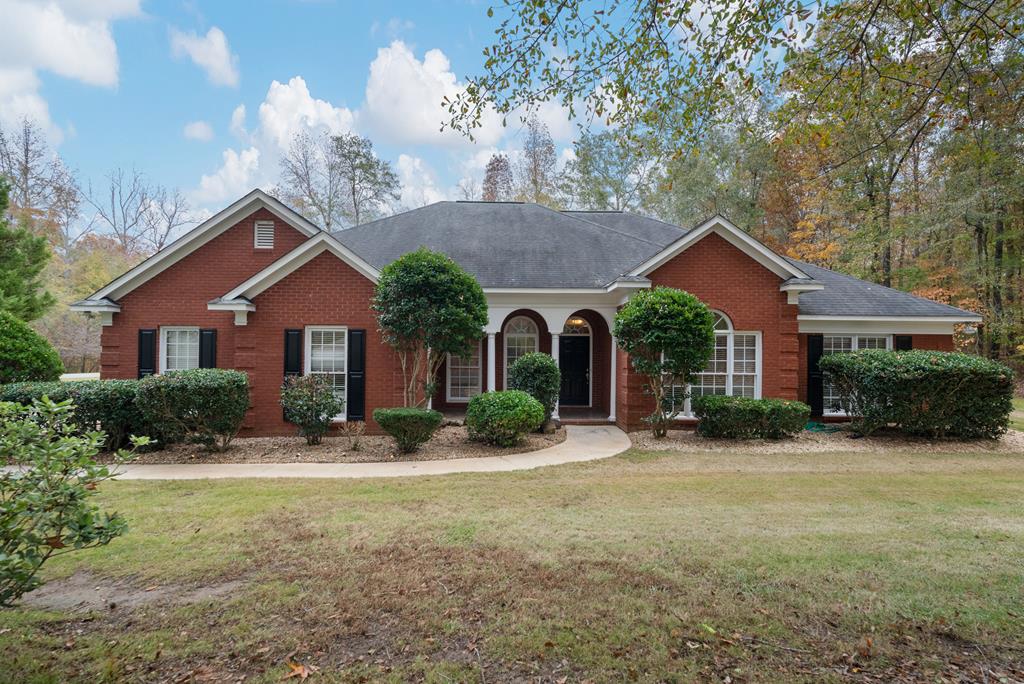 a front view of a house with a yard