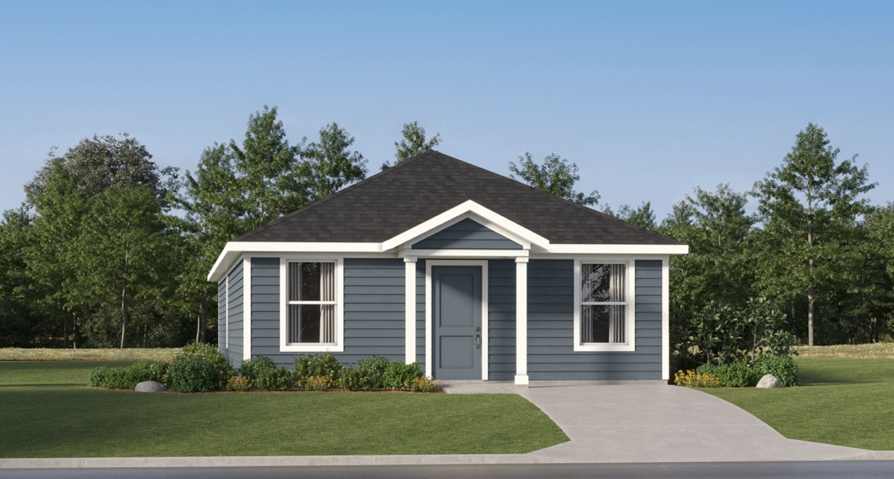 a front view of a house with a yard and trees